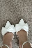 Came carefully wrapped and protected. The slimmer block heel helps elevate the shoe but is still easy to walk in. I made an extra hole in the straps so it was more secure for when I walk down the aisle. I'd wear these out on a date too! - Melissa D.