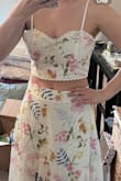 I'm pretty confused by all the other reviews on here saying it runs small. I am almost always a M for Lulus and first ordered my regular size. The skirt fit but hit a little lower on my waist than I wanted, but the top was soooo big and gaping really bad no matter what I did. I am a 34C for reference. I exchanged it for a small and now it fits perfectly. I didn't find the top to be really small, other than when putting it on. I'm more of an hourglass shape, but I'm very surprised at needing a small in this bc that's hardly ever my size on this site. - Lauren K.