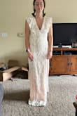 This dress is SO unflattering in the white/peach combination. The underskirt is NOT nude, it's peachy. In other colors, this dress is much much prettier. - Isabel B.