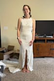 This dress is NOT flattering. If you're short and don't have a ton of curves, I would recommend against this dress. The slit is HORRIFIC - not sure who decided that. The back is STUNNING and truly the only saving grace for this dress. I am not sure how anyone is supposed to sit in it with the slit right in the middle... and it goes up kind of high. - Isabel B.