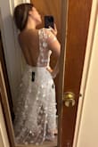 The material is so good. Everything is perfect about this dress. The only thing that didn't fit on my body was in front because I am a bit flat and it was a bit big for me. But if you would like this dress for your wedding it is perfect, the details and everything. The back is a dream. - Andrea M.