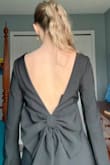 This dress was so beautiful. Super comfortable and elegant. I love the high neckline and low back. The bow is such a unique touch!! Super comfortable material but high quality and flattering. Would recommend this dress to anyone! - Natalie B.