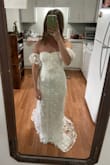 This dress was surprisingly one of my top favorites but didn't fit the style I was going for. It doesn't look like a $100 dress. Fits a little snugly because it's more stiff than other materials. - Avery R.