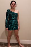 Very cute party dress. The fabric is soft velvet with sequins. Has a polyester lining, not scratchy. - Jennifer F.