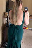It has just enough stretch to be comfortable. The color is gorgeous and I love it so much. Had to get creative with the bra situation, but I found a body suit with no back that works. I personally wouldn't go without a bra - Hannah A.