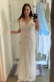 I'm so happy with this purchase. Elegant and what a price point. I needed a wedding dress that would allow me to wear a regular bra. So many designs are not made with that in mind. It was the first I ordered and it worked. Check. The fabric is light and the dress is beautifully made with sequin detail. I'll need to have it hemmed a few inches. It fits so well and I feel I could go up or down 5lbs and it would still fit. - Rossana S.