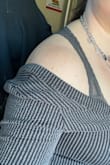 I was disappointed when I first tried it on but now it's not too bad. I wouldn't feel comfortable wearing this shirt without a tank underneath. I ordered a large and it fits great everywhere but the neckline is way too wide. This makes it fall off the shoulders but it doesn't look right because there are shoulder stitching and shaping so you can tell it is meant to be on the shoulders. - Anna H.
