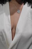 I only rated this 1-star because zero wasn't an option. This top fit nothing like what's shown on the model. It basically hangs open to your belly button. It's thin and poorly stitched. It has no structure whatsoever. It looks and feels cheap. Lulus knows they are wrong for charging people $50 for this. I'm very disappointed. I will not be purchasing from this store again nor would I recommend it to anyone else. - EA S.
