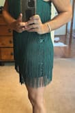 Dress was delivered within 2 weeks to Australia; I paid extra for fast delivery. The dress is exactly as advertised. Looks amazing on and fits well. The underlayer of the dress is short though; however, the tassels assist with this being longer. The straps are very thin and seem a little flimsy for the weight of the dress. Straps are adjustable, which helped with pulling the dress down slightly. Overall, I am very happy and would definitely buy another dress or garment from this company. My wedding is in 2 weeks in Vegas! - Rowena P.