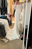 I ordered this dress just to try it on, expecting to return it. Fit like a glove and so elegant. It's as beautiful as the $3000 dress I tried on at the bridal boutique. I will be wearing this iconic dress when I say I do. - Saraleah P.