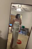 The bow sits beautifully it had no problems. The dress is long so I did have to find heels big enough other than that this dress is dreamy
I love it! - Brianna M.