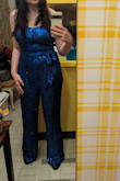 Bought this jumpsuit for the Feist concert, and channeled her music video outfit for "1234" with this blue strapless jumpsuit. It fit well, but the torso was a bit long and the pant legs were extremely long for a shorter person such as myself...but it didn't take long to hem! I received compliments on the jumpsuit, and it is comfortable to wear. The only thing is that the sequins can occasionally snag on themselves. - Leah M.