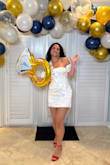 I love this dress! I usually stay away from mini skirts, as I have a bigger bottom half and am a bit taller. But this dress was a dream! The back part of the skirt is even slightly longer than the front so I didn't have any flash moments! It does wrinkle easily, but a quick steam fixed it! - Sabrina B.