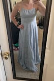 The dress fits well, a little heavy so I could see potentially it cutting into shoulders after a full day of wearing it. It is a very long but overall pretty dress. It washes me out completely. Even though it matched my sister's wedding colors, we are going another route. But overall, I would recommend it! - Brittany S.