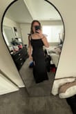 This dress is fitted so well and it's the perfect length. the bows as the straps are so cute. It's pretty comfortable for being a fitted dress. I highly recommend it. - Kaia A.