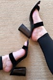 These suede high heel sandals far exceeded expectations. I was a little worried since they were final sale and others had said sizing ran small. I'm anywhere from a 10-11 with very narrow feet, so in this style of shoe (open-toed mule with high heel), I always order a 10 to make sure my feet are secure. These fit perfectly; the suede is soft and supple, and my toes and heels don't hang over the edge (see picture.) The black of the suede is EXTRA black, which looks so chic. But my favorite thing is the heel. It doesn't look like fake wood: it's solid, rich in color and texture, and looks very high quality. The angles and design of the block heel also appears to be more designer/high end. These shoes look at least $100 more expensive than they are, and I couldn't be happier. - Phoebe E.