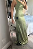 I am a bridesmaid for my friend's wedding, and I like how this dress fits on the top part. I am a little big on the bottom (hips and butt), and it does feel a little tight in that area, I wish it was a little more loose because, if I eat too much, my belly will show a little bit lol. Also, it was long, even with heels. I had to take it somewhere so they could do a hem. - Irina G.
