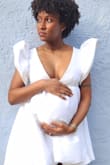 This was the perfect dress to debut my bump in! I am a size small and I sized up to medium. Perfect and comfortable and I received many compliments! - Jazmynn T.