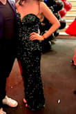 I wore this dress to a moulin rouge-themed gala and at first was nervous it might be too revealing with the leg but quickly realized it was not! I got so many compliments all night. Great material, and tons of sequins, and the feathers are a perfect touch. Highly recommend! - Kaci B.