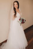 This dress was absolutely beautiful and exactly as pictured. - Laura F.