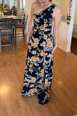 It was a little difficult to zip on the side, but it managed. I really felt this hung quite well, but it was a little too spring for my event. It was a little long, but with heels would be fine. - Sophia M.