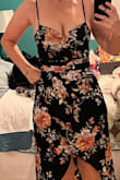 The dark navy and flower pattern are beautiful. Dress is too revealing for my age and taste. - Cindy H.