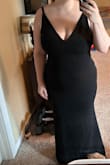 I love this dress. The material feels amazing. It has a slight stretch for comfort, and the material is good quality and thick. With the dark color, material, and darts across the bust, I don't need a bra - Hannah A.
