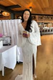 I LOVE this dress! I wore it for my bridal shower, and people genuinely believed I was getting married right then and there. The fit is quite fitted, but I wouldn't go up a size. The details were beautiful, and it's really great quality. I highly recommend this dress! - Bushra M.