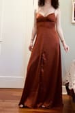 The dress is as pictured. Beautiful rusty color with a thick silky material. Definitely will need to wear heels and may hem it a bit. Bought for a wedding. - Rachael R.