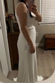 This dress is exactly what I was wanting for our upcoming vow renewal... It is absolutely beautiful! I like the simple, classic style, and I especially love the button details on the back, as I also had those on my actual wedding dress 10 years ago. The material is soft and comfortable with a slight bit of stretch. I am having a few alterations done (hemming since I'm short and having the straps sewn. While it's nice that they are adjustable, I didn't like that the hardware to allow it was so visible, but these are minor things and just personal preference). Overall, I'm very happy with this dress, especially for the price! Thank you, Lulus!! - Lee E.