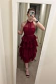 I was kinda worried I would look like a loofa but it was actually so cute! It came out of the box super wrinkled (as seen in the picture) and I don't own a steamer - but I left it in my bathroom while I showered and I would spray it down with a spray bottle for a couple of days and all the wrinkles fell out! The neckline is a tad itchy but I really didn't notice it much. My one note is it's a little bit of a darker wine color than pictured here but I didn't mind. - Hannah L.