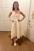 Beautiful, full skirt on the dress. It is tight in the chest and shoulders. I plan to wear it for my wedding welcome event! - Tessa M.