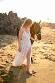 I bought this dress for some engagement photos on the beach. The top part was really loose on the sizes, but after a friend sewed it so it was taut, it looked great! The nude bodysuit underneath is visible through the lace, so I'm not sure I'd wear it for any other occasion but was great for pictures. - Lauren K.