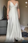 I wanted to love this dress. It was simple, fun, and allowed for movement for dancing. It fit very well, the dress was very long. Nothing a hem couldn't fix. The only problem I had was how see-through the material was. You could see the pockets & the part the zipper was sewn to. - Cassandra K.