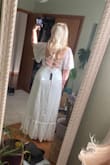 Fits true to size! Super high-quality material and really flowy and pretty. The tie-back adjusts so you can cinch the waist and give the girls a little support! Had to get it shortened but I expected this since any maxi dress usually needs to be shortened an inch or two for my height. - Elissa M.