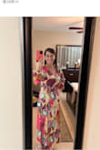 This dress is a lot prettier than I expected; the colors are amazing! Looks expensive and elegant. The material is very nice, breezy and silky soft not stretchy. This is a maxi wrap dress, with a tie waist that cinches at the slimmest portion of the torso. The wrap dress gives an ultra-slimming effect. The top part was a bit tight on me so I had to use a safety pin to hold that together. The day was really windy so I had to make sure I was holding it together from the skirt part. One strong breeze and that slit will open all the way to your waist. I bought size Small, I am 5'4, 36C, 126 pounds, 30" waist, 40" hips and thighs. I received lots of compliments - Martha P.