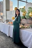 Wore this for my baby shower and I was so comfortable that I didnt even take it off for the 3-hour drive home afterwards! Silky, soft material that felt buttery all around. Stretchy enough in the belly to accommodate my 8-month belly. Lovely draping at the bottom gave me room to move around. A deep rich green color that matched the images. The perfect length for 5'4'' with bootie heels. I was so worried about pit stains because I sweat too much when not pregnant and this miraculously left me pit stain free! I will be keeping this in the closet to wear again once this baby is out too! More than worth the money. - Angela S.