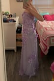 I love the dress. The dress fits very nicely around the top. My only thing is that right under the armpits feels slightly itchy, but I plan on wearing it regardless because I just love the dress overall. The bottom of the dress touches the floor a bit (I'm 5'5"), but in heels it doesn't tough the floor. - Olivia M.