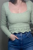 This top is a very nice colour green and quality is great! its pretty cropped so beware of that! Fits perfect with a very high waisted pair of pants/jeans! I ordered a size S (my regular size) and fit true to size! (I am a 33 inch bust for reference) Great to wear casual or as a going out top! Happy with my purchase! - Miranda C.