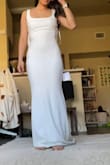 This is such a pretty and flattering dress. It's so sleek and modern! This would have been my dress if it wasn't for a few issues that I noticed. The bodice seems to have extra fabric so it had this fold that I can't seem to push out of the way. Also, I feel like the bow was a little weird and could have been pinched or ripped as opposed to a flat strip. The fabric is also a stretchy fabric, not exactly a bridal-type fabric. But overall, I loved the dress and felt so stunning in it. - Anna L.