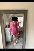 I probably range between an 8-12 (M/L) pant size depending on the brand and this dress fits great.  I ordered a large and it has a zipper in the back but I didn't even have to unzip it to get it on.  The two ties in the back really make the dress sweet.  I'm 5'10-5'11 and it's just long enough that I still feel comfortable.  If you're 6' + I would just take that into account.  Also if you have a large bust, this might not be the dress for you.  I'm probably a large B, small C and the amount of room I have in the dress is just right. The sleeves are a little awkward fitting wise but I don't feel like they're going to fall down. - Alexis C.