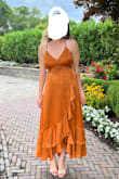 I loved this dress so much! It popped and was perfect for a summer wedding. It fit true to size. I don't ever wear orange but this color was just so beautiful with my pale skin tone. The back of the dress was so beautiful. I loved the dainty straps. I would highly recommend this dress! - Tara M.
