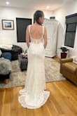 This dress exceeded my expectations. I wanted something simple and comfortable. It's very flattering and the back is stunning. It doesn't fit too tight which I love and I won't need to alter the dress if I wear heels. I also love the small train. I bought two to try on and I decided to go with this one. - Carrie M.