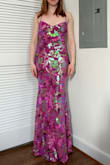 It's a gorgeous dress. I will need boob tape to keep it up because the straps are not at all strong, and it's very long. I'm only 5'5'' but even with my 4-inch heels, it's dragging on the floor an inch. My only complaint is that it sheds sequins everywhere - my floor is now littered with them and I've only tried the dress on once. But it's beautiful! I'll turn heads at the gala! - Trisha H.