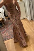 This dress feels much more expensive than it is. Beautiful color and the fit is amazing. It cinches the waist and is super flattering on the tummy. I'm in a size L and I'm 5'6; I won't need to hem it if I wear a little heel. It's comfortable and I don't feel like I'm spilling out of the top at all. The bottom flare is dramatic without being too over the top. Love it. - Kristine D.