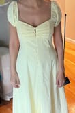 So I love the baby yellow color on my deep olive skin tone, however, because I'm small on top, short torso and wide hips I found that the top was too big and the bottom was flowy and forgiving the way I like my a-line dresses in summer. So I just ordered the xs to see if I can get a better fit on top. In my opinion, there's no way to wear this dress other than with a strapless bra so fit on top has to be good otherwise you'll be exposed or pulling to keep it up. Love the dress but depends on your body type and whether you can pull it off. The picture is me in the size small. - Marline K.