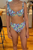Cute set, but as you can see from the picture the blue isn't as vibrant as depicted on the model. Still cute. Trying to decide if it is too young for me.. The print is busy and may be for younger women. Either way, super cute and good quality. - Marline K.