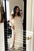 I freaking love this dress. The sleeves are a dream. It fit my torso perfectly. Definitely too long so I had to get it hemmed. Fabric is insanely thin, and you can see my undies so buy a nude slip. Love where it cuts my waist to give me some kind of shape. Slit is at a great height. Zipper gets stuck, but I just had to pull it taught at the bottom. Overall, super happy. - Elizabeth M.