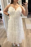 If "meh" was a dress it's this dress. Bought to wear for my bridal shower but will be returning. Makes me look like a little girl. Floral appliqués are nice but they don't save this dress. - Stephanie K.