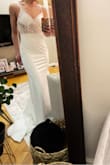 This dress is very well made. Looks and feels expensive. Very form-fitting, but thick quality fabric doesn't show any lumps or bumps. The length is nice with heels and I could easily walk in this dress. I didn't have anyone home to help zip up the back, but I loved the open back and the details on the straps. Very elegant. - Kacie R.